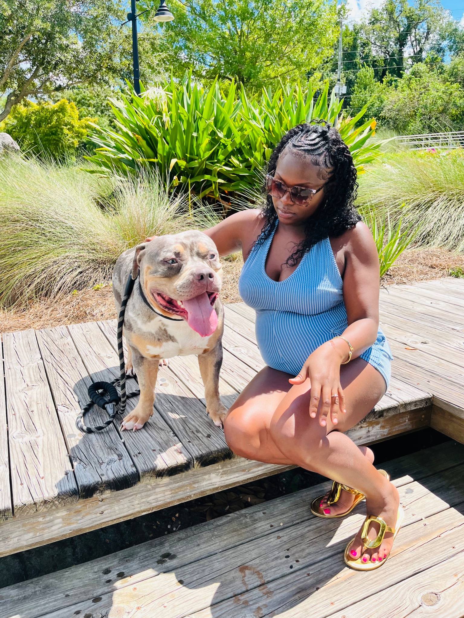 Talia Riley seated beside Tank