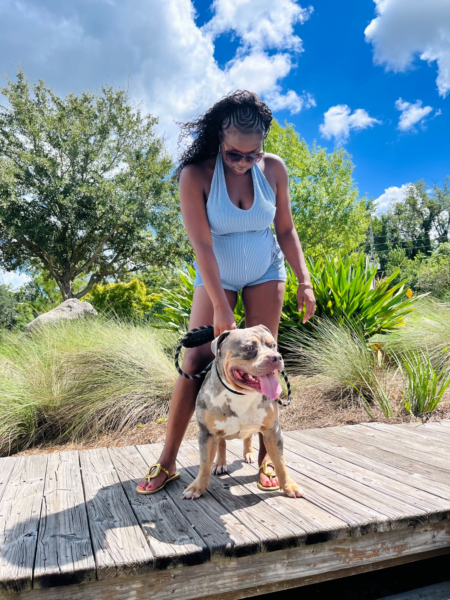 Talia Riley standing with Tank outdoors